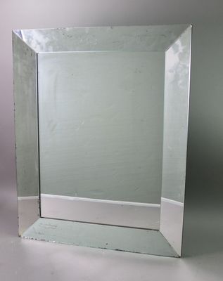 a mirror that is sitting on a white table