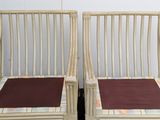 two chairs that are sitting next to each other