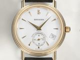 une image montrant un gros plan d'une montre-bracelet au cadran blanc