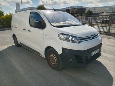 a white van that is parked in a parking lot