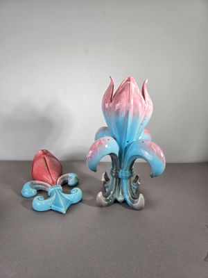 two figurines that are sitting on a table