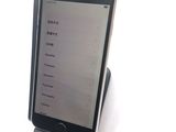 a cell phone that is sitting on top of a stand