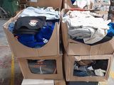 several boxes of clothing are stacked on top of each other in a warehouse