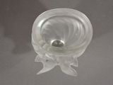 a glass vase with a silver ball inside of it