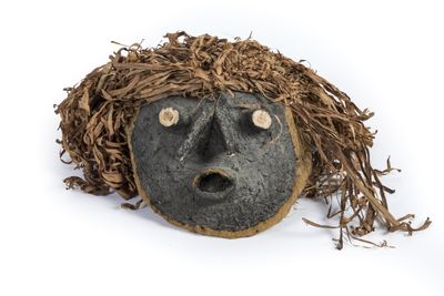 an image of a face made out of a piece of wood
