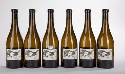 six bottles of wine are lined up in a row