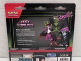 the back of a box of pokemon figurines with a purple and black dragon