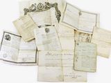 a pile of old letters and papers on a white surface