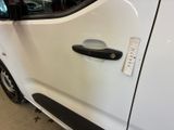 a close up of a car door handle with a sticker on it