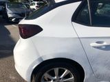 a white car that is parked in a parking lot