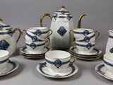 a group of tea and coffee cups and saucers on a table