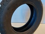 a close up of a tire on a white surface
