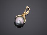a black pearl pendant on a black background