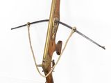 an image of a wooden rifle with a rope attached to it