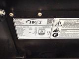 a close up of a car ' s engine with a warning sticker on it