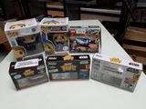 a lot of star wars pop vinyl figures on the table