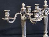 pair of antique silver plated candelabs with candles