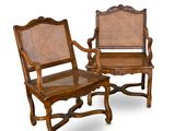 pair of antique chairs with cane back and armrests
