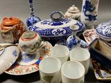 many different types of porcelain items on the table