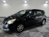 a picture of a small black car parked in a garage