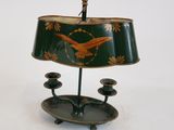 a green lamp with a bird design on it