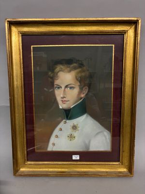 portrait of a young boy in a military uniform in a gold frame