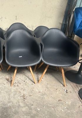 four chairs that are sitting in a row on the floor