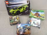 une boîte de Lego Technic posée sur un canapé