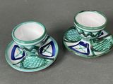 pair of blue and white tea cups and saucers on a gray surface