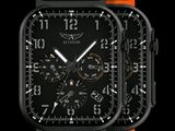une montre noire et orange avec un cadran noir sur fond noir