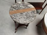 a table with a marble top and a side table with a wooden base