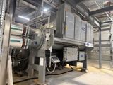 a machine that is inside of a building with a lot of pipes