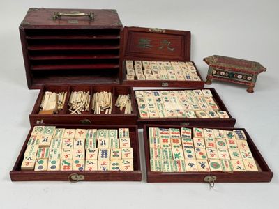many pieces of domino board in a wooden box