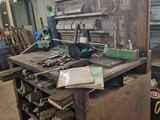 an image of a workbench in a workshop with tools on it