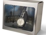 a picture of a watch in a box on a white background