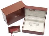 a box with a ring inside of it on a white surface