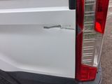a close up of a car ' s tail light on the side of the car