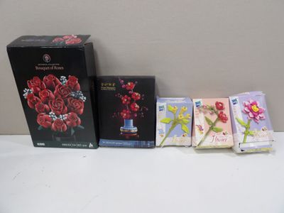 a bunch of cards and a box of flowers on a table