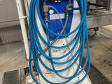 a blue hose that is attached to the side of a building