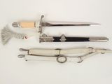 several different types of knives are displayed on a white surface