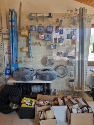 a room with a lot of tools and supplies on the wall