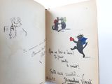 a book with a drawing of a cat and a dog on it