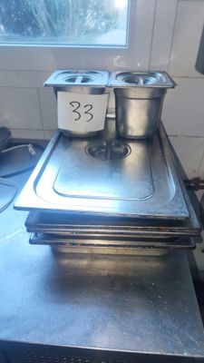 three pans sitting on top of a stove in a kitchen