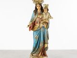 a statue of the virgin mary holding a child