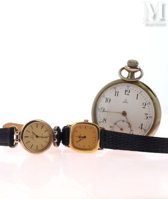 three different types of watches sitting next to each other on a white surface