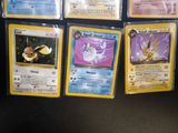 a lot of pokemon cards that are on the table