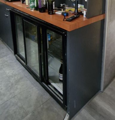 a bar with a lot of bottles on top of it