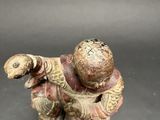 an image of a figurine of a man holding a baseball bat