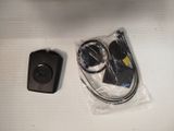 a picture of a remote control and a charger on a table