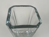 a glass vase that is sitting on a table